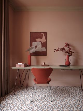 terracotta living room with Moroccan style vinyl flooring and a red home office corner